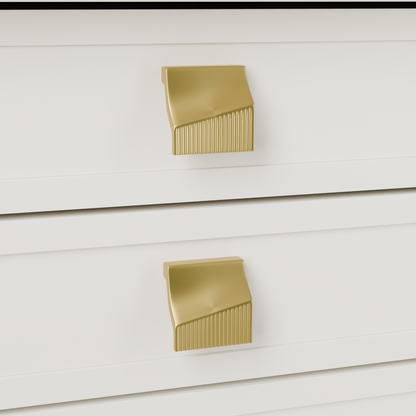 Acrux Knob in Brushed Brass (PVD) installed on warm chalk cabinetry - drawer detail, square view