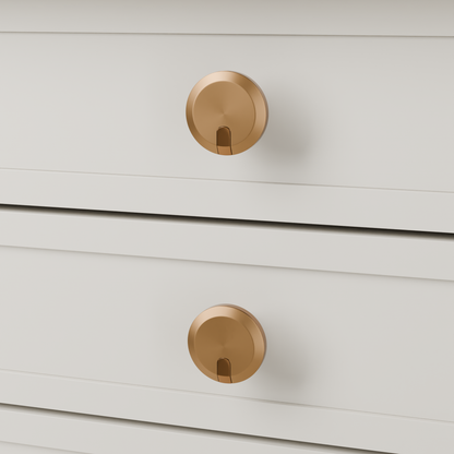 Orion Knob in Brushed + Polished Copper (PVD) installed on oyster stone cabinetry - drawer detail, square view