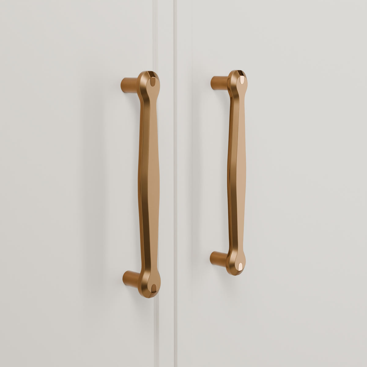 Orion Pull in Brushed + Polished Copper (PVD) installed on warm chalk cabinetry - vertical pair, square view