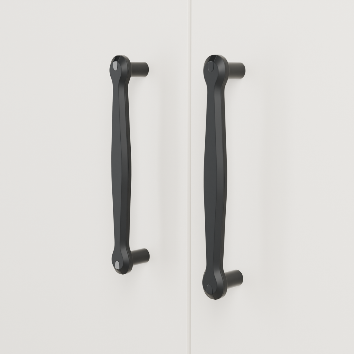 Orion Pull in Polished Black + Matte Black installed on warm chalk cabinetry - vertical pair, square view