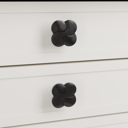 Saiph Knob in Polished Black + Matte Black installed on warm chalk cabinetry - drawer detail, square view