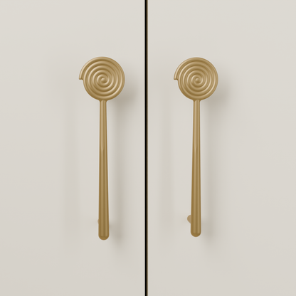 Solara Pull in Brushed Brass (PVD) installed on warm almond cabinetry - vertical pair, square view